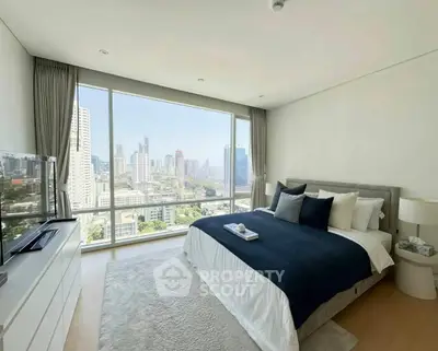 Luxurious bedroom with stunning city view and modern decor