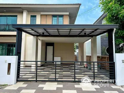 Modern two-story house with spacious carport and sleek gate design