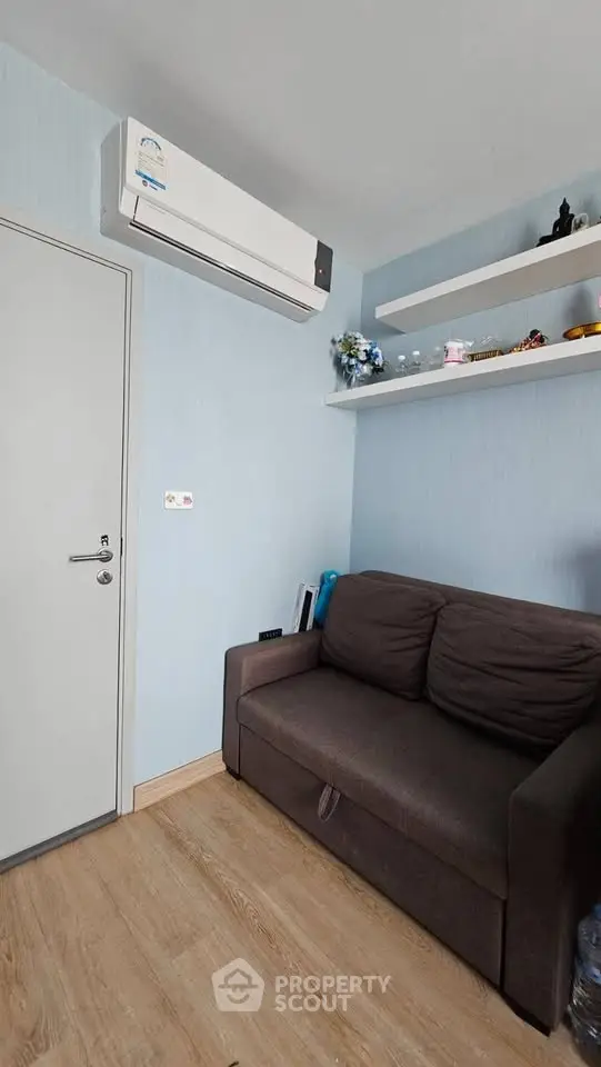 Cozy living room with modern air conditioning and stylish shelving