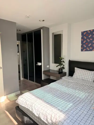 Modern bedroom with stylish decor and ample natural light