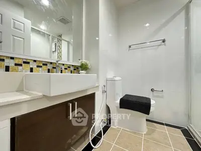 Modern bathroom with sleek fixtures and stylish tile accents