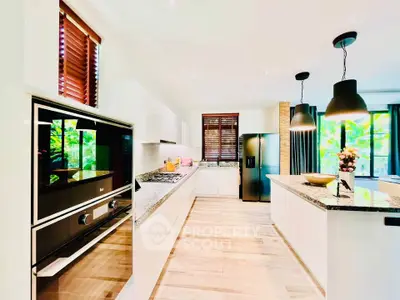 Spacious modern kitchen with sleek appliances and open layout