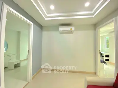 Modern interior with air conditioning and recessed lighting, showcasing a sleek and minimalist design.