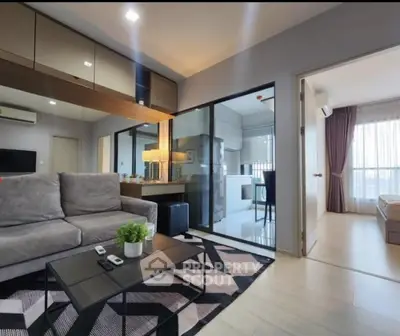 Modern living room with stylish decor and open layout leading to a bright bedroom