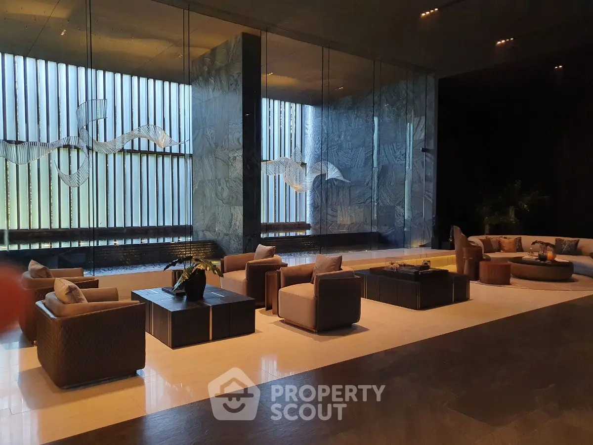 Luxurious modern living room with elegant seating and floor-to-ceiling windows