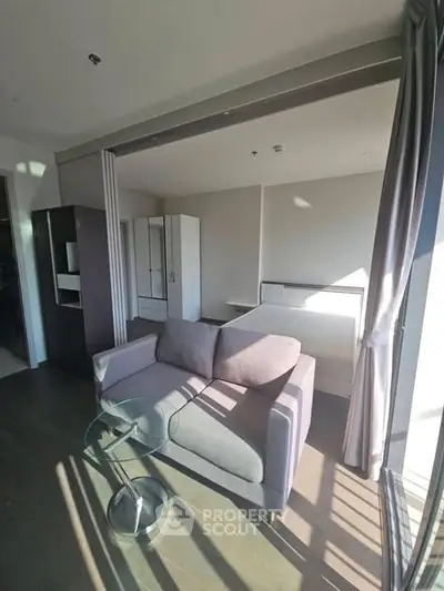 Modern living room with sleek furniture and abundant natural light