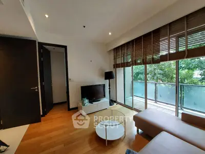 Modern living room with large windows and balcony view