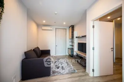 Modern living room with cozy sofa and stylish decor in a contemporary apartment.