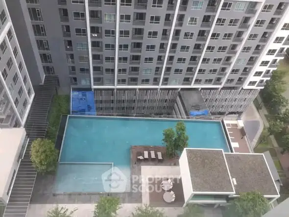 Modern high-rise building with a luxurious rooftop pool and garden view.