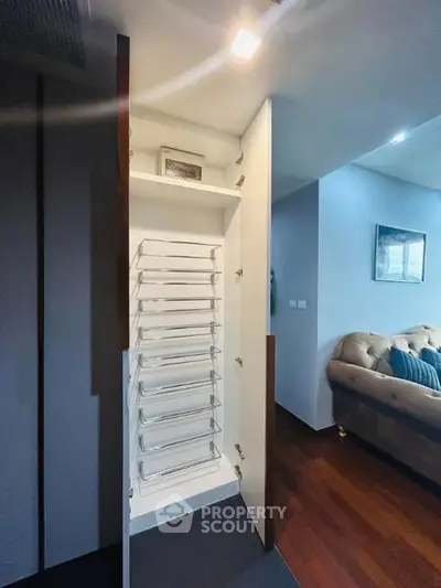 Modern living room with stylish storage cabinet and cozy seating area