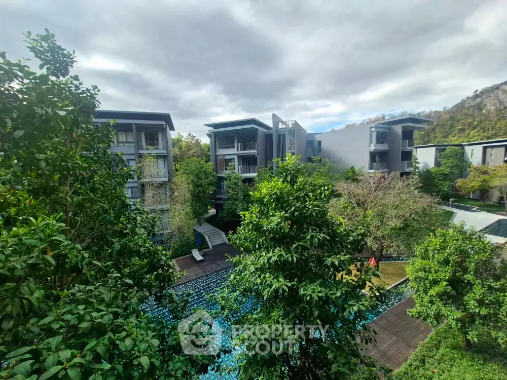 Modern residential complex with lush greenery and scenic views