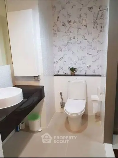 Modern bathroom with stylish sink and elegant tile design