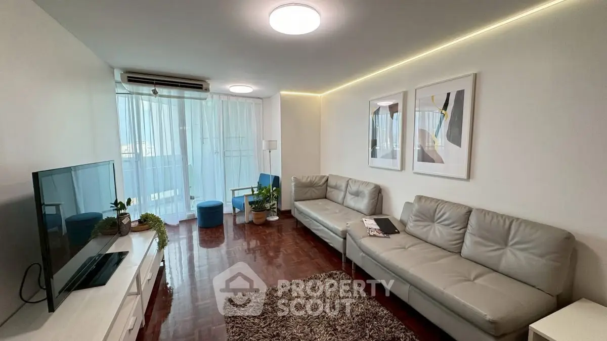 Spacious living room with modern decor and natural light