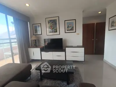 Stylish living room with modern furniture and balcony view