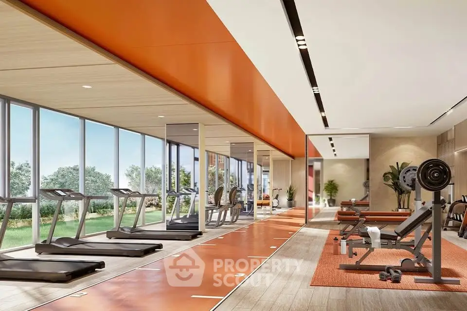 Modern gym with state-of-the-art equipment and large windows offering garden views.