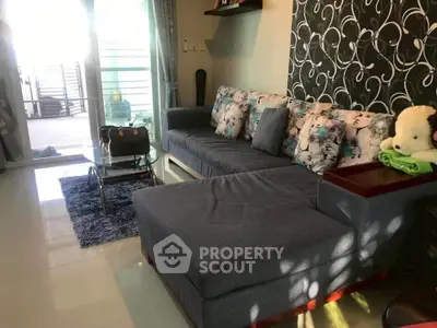 Stylish living room with modern sectional sofa and chic decor, perfect for relaxation and entertaining.