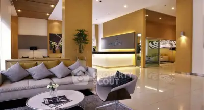 Luxurious modern lobby with elegant seating and stylish decor in a high-end residential building.