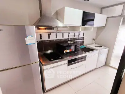 Modern kitchen with stainless steel appliances and sleek cabinetry