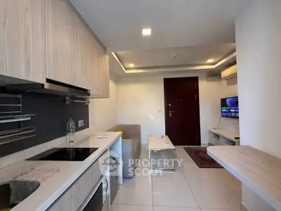 Modern compact living room with open kitchen and sleek design