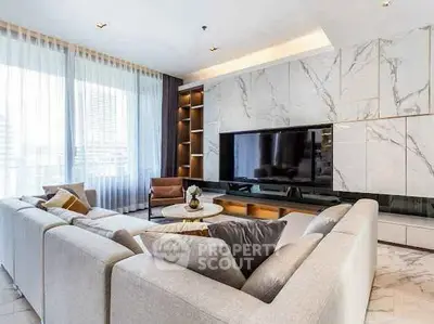 Luxurious modern living room with elegant marble accents and spacious seating area.