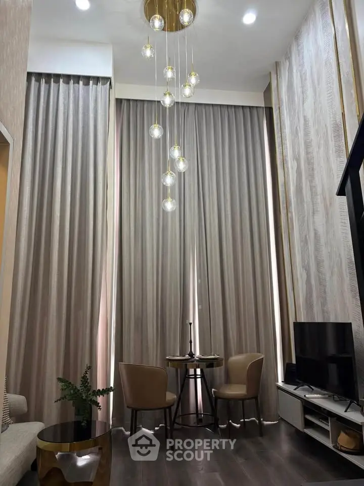 Luxurious high-ceiling living room with elegant lighting and modern decor