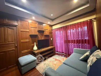 Cozy living room with wooden paneling and modern furniture