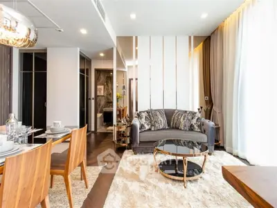 Luxurious modern living room with elegant decor and dining area, featuring stylish furniture and ambient lighting.