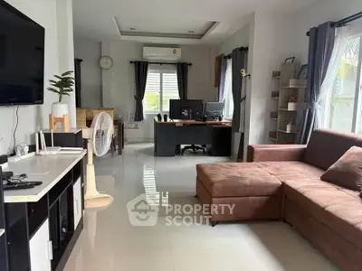 Spacious living room with modern decor and large sectional sofa, perfect for relaxation and entertainment.