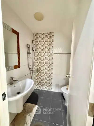 Modern bathroom with stylish tiles and sleek fixtures