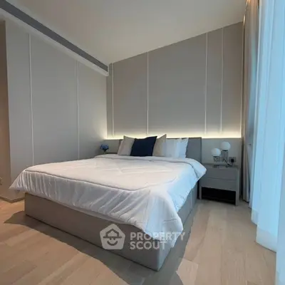 Modern bedroom with elegant design and cozy lighting in a luxury apartment.