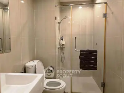 Modern bathroom with glass shower and sleek fixtures