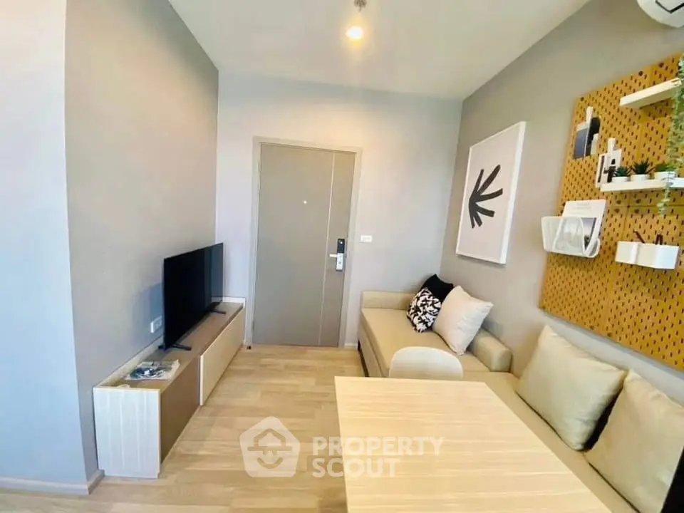 Modern living room with stylish decor and cozy seating area, perfect for relaxation and entertainment.