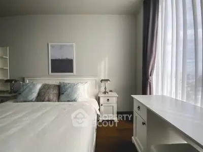 Elegant bedroom with natural light and stylish decor