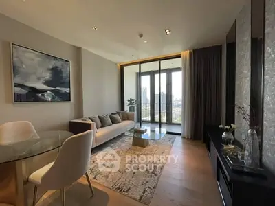Modern living room with city view, elegant decor, and natural light