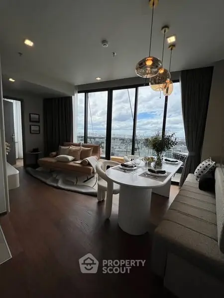 Luxurious modern living room with panoramic city view and elegant dining area.