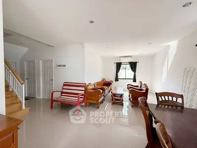 Spacious living room with elegant wooden furniture and natural light