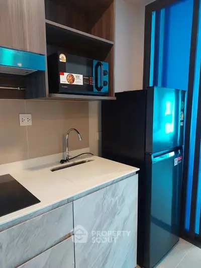 Modern kitchen with sleek appliances and stylish cabinetry