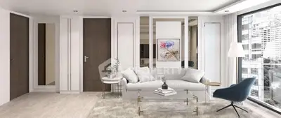 Elegant modern living room with stylish furniture and large window view.