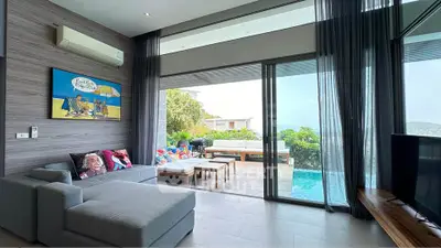 Luxurious living room with pool view and modern decor