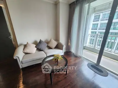 Cozy living room with elegant sofa and balcony view in modern apartment
