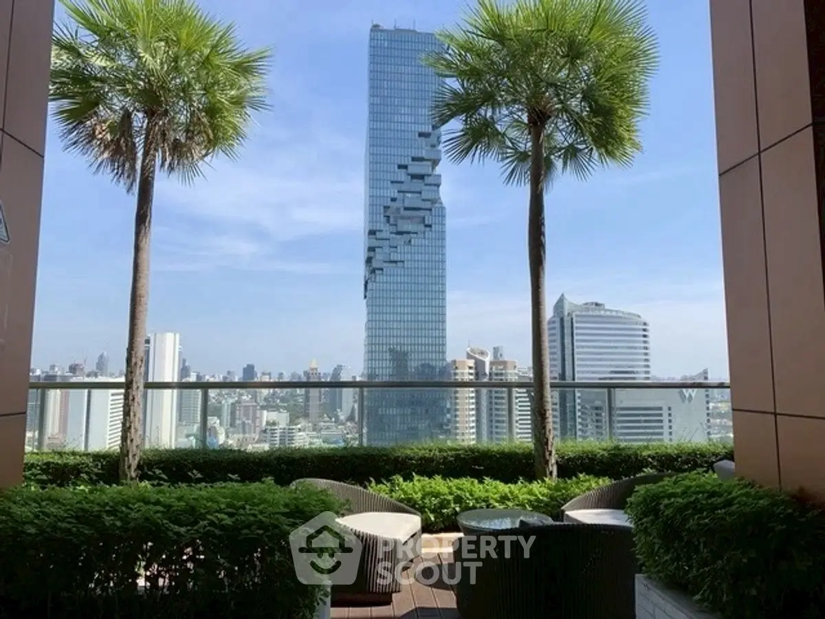 Stunning city view from a lush rooftop garden with modern seating area.