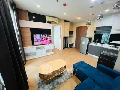 Modern living room with stylish furniture and open kitchen layout
