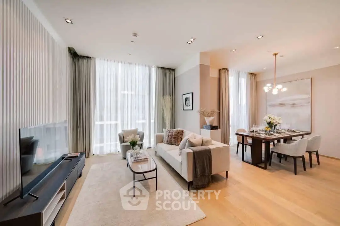 Spacious modern living and dining area with elegant decor and large windows.