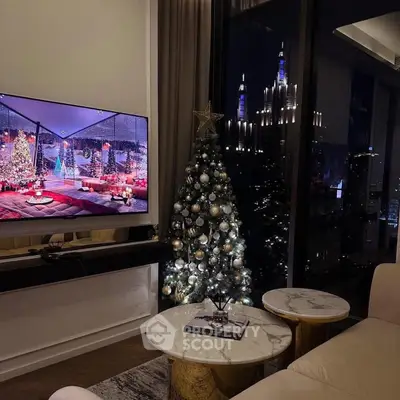Luxurious living room with festive Christmas decor and stunning night city view.