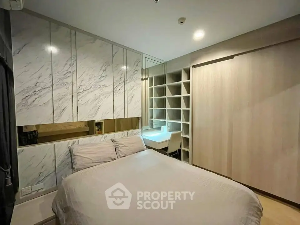 Modern bedroom with stylish built-in storage and elegant marble accents
