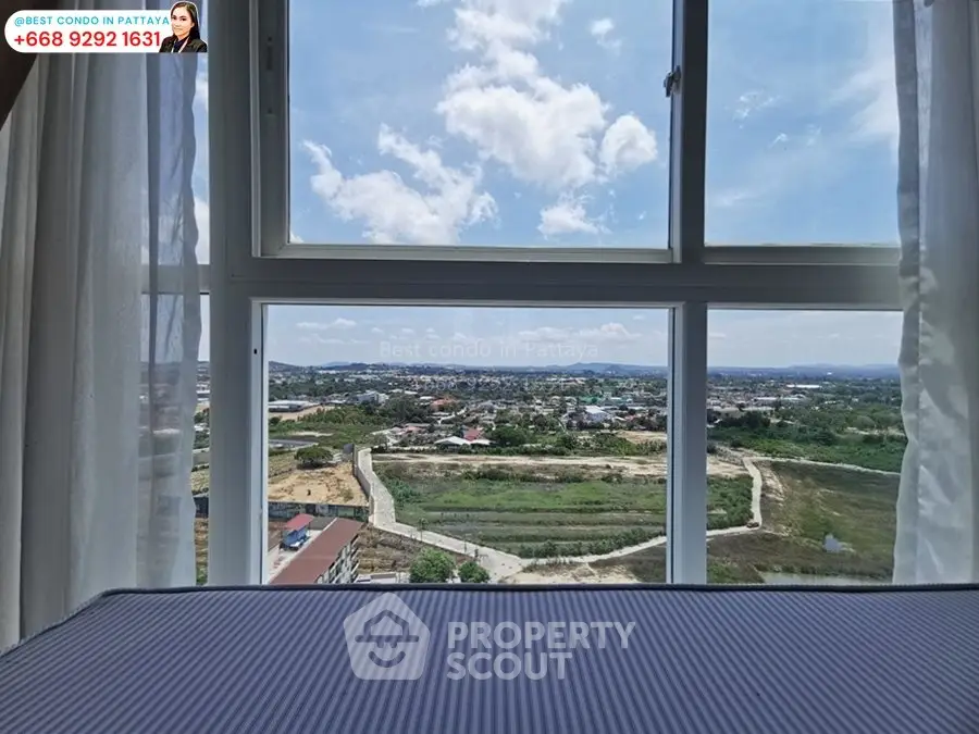 Stunning condo view in Pattaya with expansive windows overlooking scenic landscape.