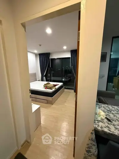 Modern bedroom with large windows and cozy decor in a stylish apartment