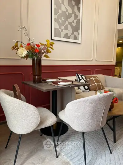 Chic dining area with modern decor and elegant seating in a stylish apartment.