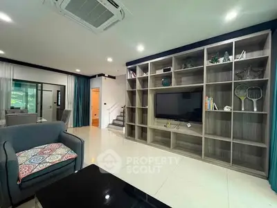 Spacious modern living room with built-in shelving and stylish decor