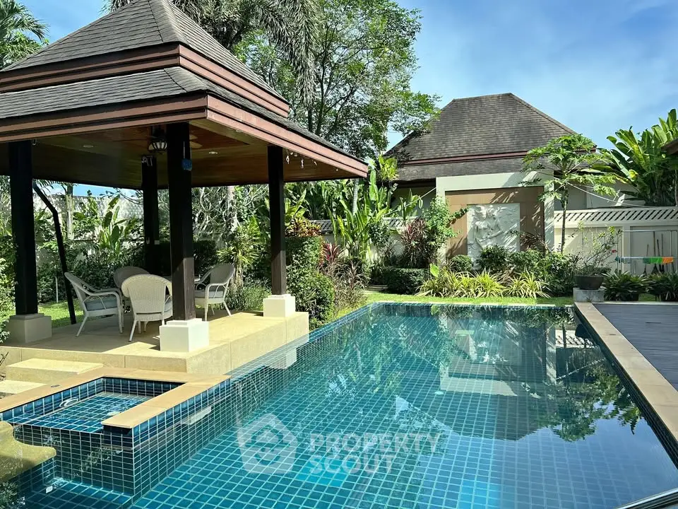 Luxurious tropical villa with private pool and lush garden, perfect for relaxation and entertaining.